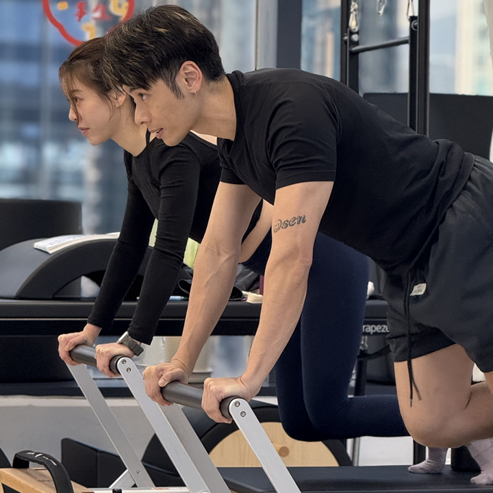 two people using pilates machines at blute pilates studio in hong kong 